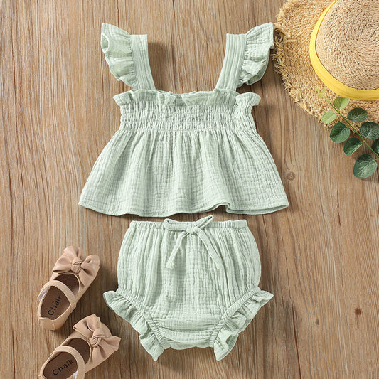 Girls' Solid Color Sling Top Shorts Set in green, featuring a ruffled top and matching hot pants.