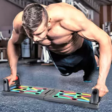 Man using the 9 in 1 Push up Rack for a challenging upper body workout in a gym setting.