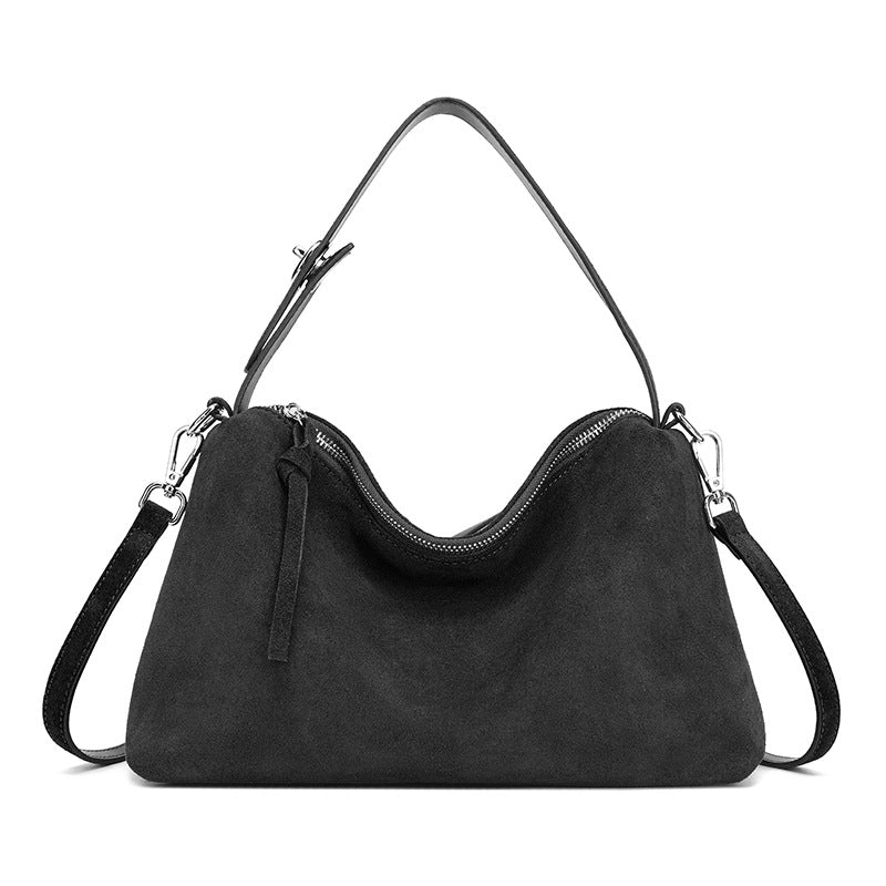 Genuine suede leather tote bag in black with double straps and zip closure, ideal for stylish everyday use.