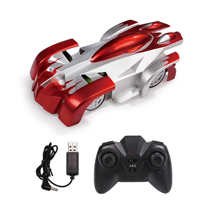 Wall climbing remote control car with red and silver design, including controller and charging cable for kids.