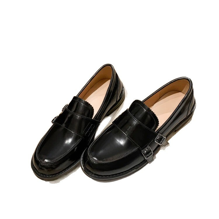 Retro distressed brown leather shoes in black color with chunky heel and belt buckle design.