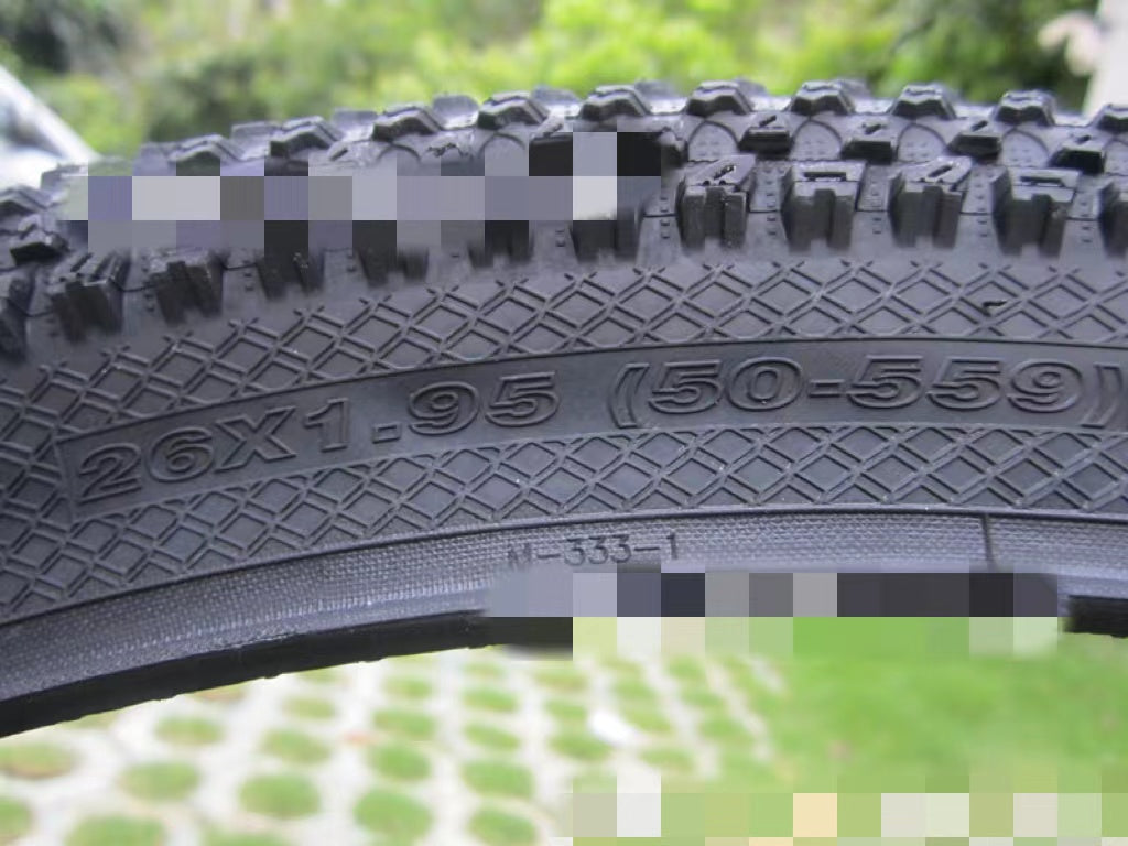 ultralight puncture proof mountain bike tire with 26X1.95 specifications and textured tread design
