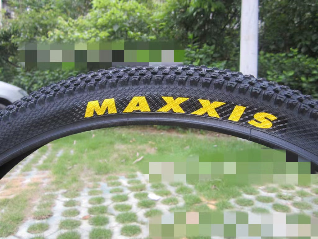Ultralight puncture proof mountain bike tire with Maxxis branding on the sidewall.