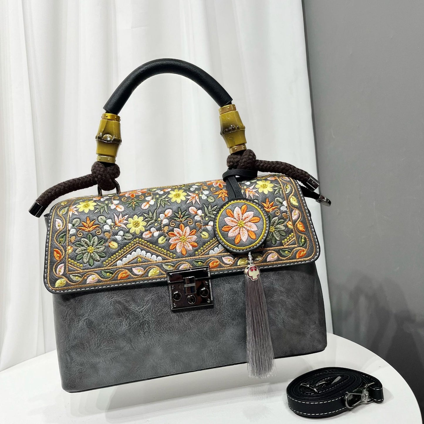 Large capacity casual bag for women with embroidered design, durable material, and stylish accessories.