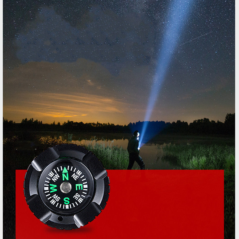 Man using a DV3000 Flashlight Multi Function Sports Camera to explore at night with a compass in foreground.
