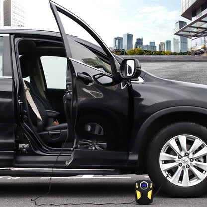 Portable digital tire inflator in use next to a car with an open door, showcasing convenience and accessibility.