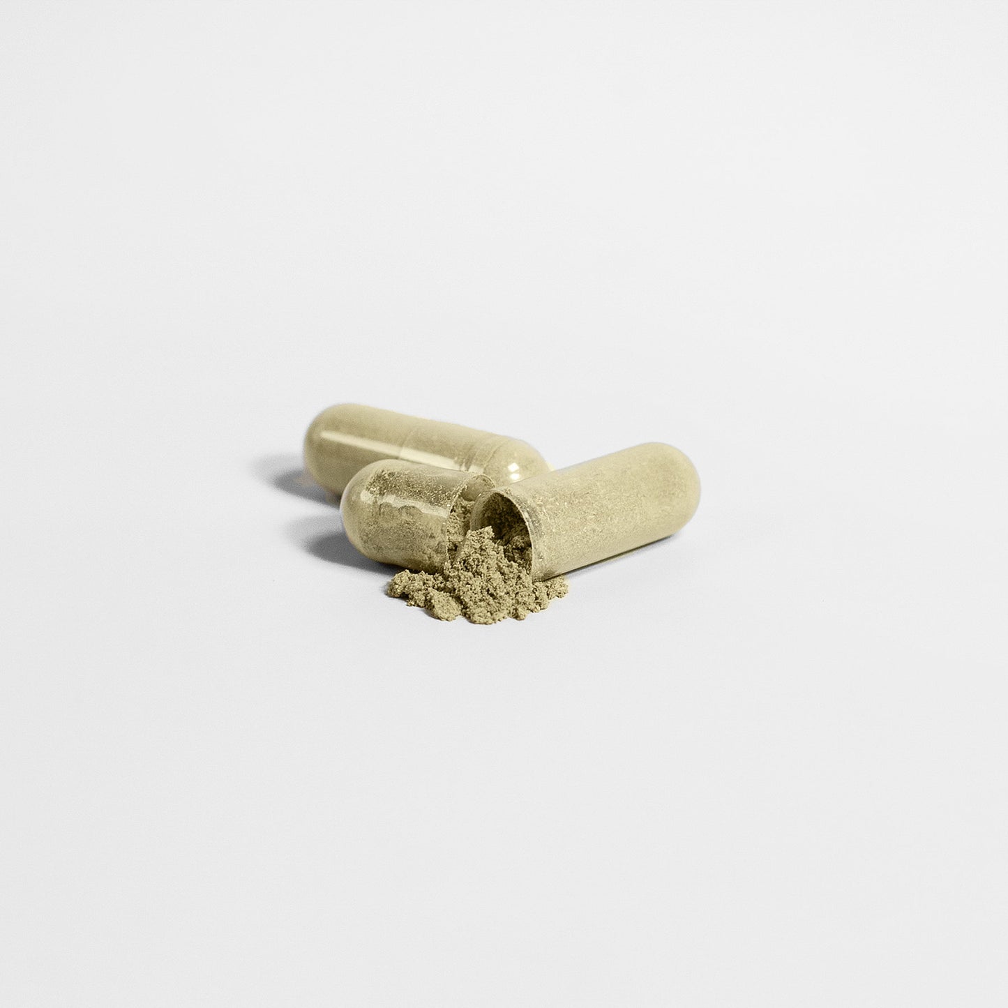 hair skin nails supplements in capsule form with powder spilling out.