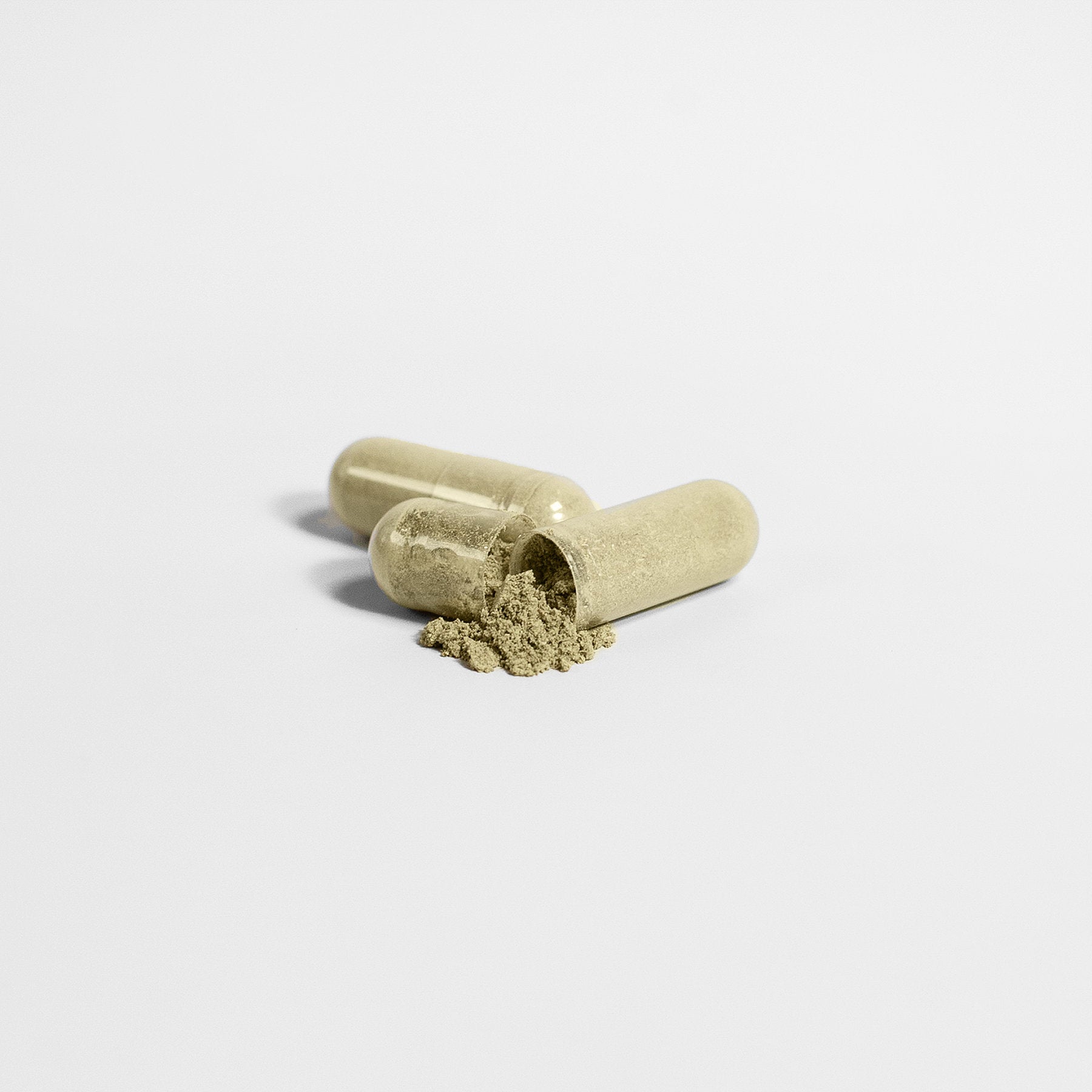 hair skin nails supplements in capsule form with powder spilling out.