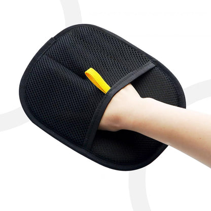 Hand wearing black electrostatic hair removal gloves for pets, showcasing the mesh cloth design and fitting.