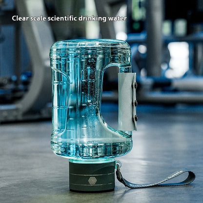 Portable kettle for mineral water bottles with clear scale, designed for easy hydration during workouts.