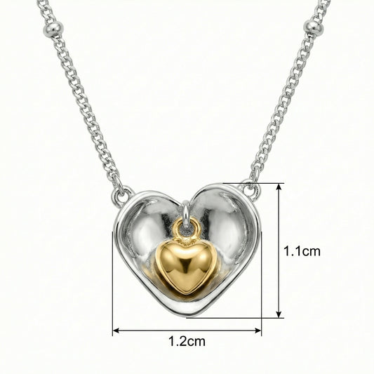 925 Sterling Silver Nested Heart Pendant Necklace with Two-Tone Accents, featuring a gold inner heart.