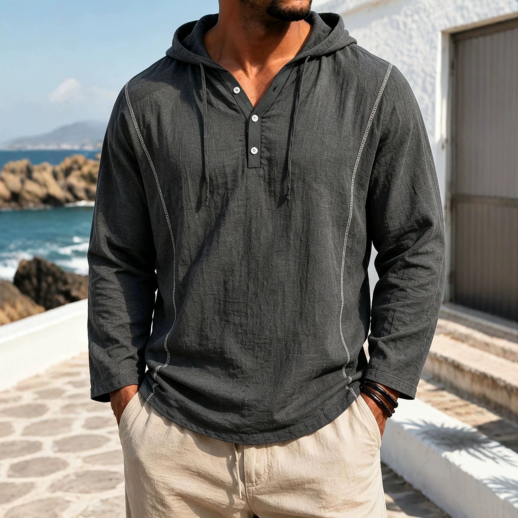 casual loose-fitting hooded sweatshirt for men in gray, stylish pullover with long sleeves by the beach
