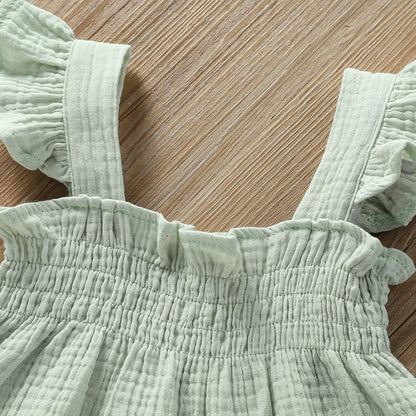 girls solid color sling top shorts set in soft green fabric with ruffle details on straps