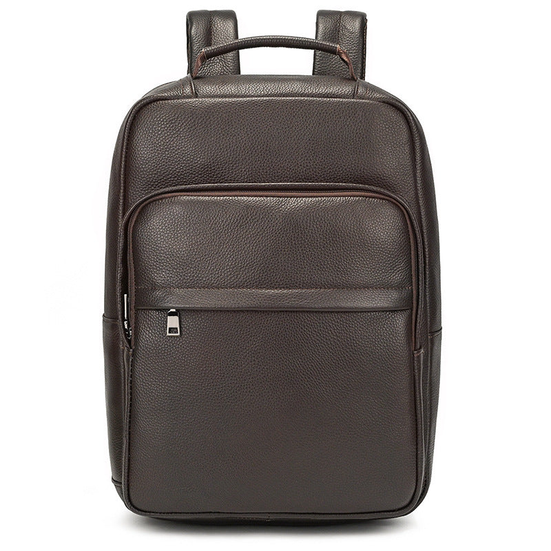 Men's genuine leather commuter backpack in solid brown cowhide design, featuring front pocket and curved straps.