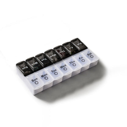 Black and white large capacity detachable pill box for storing seven-day pills, modern plastic design.