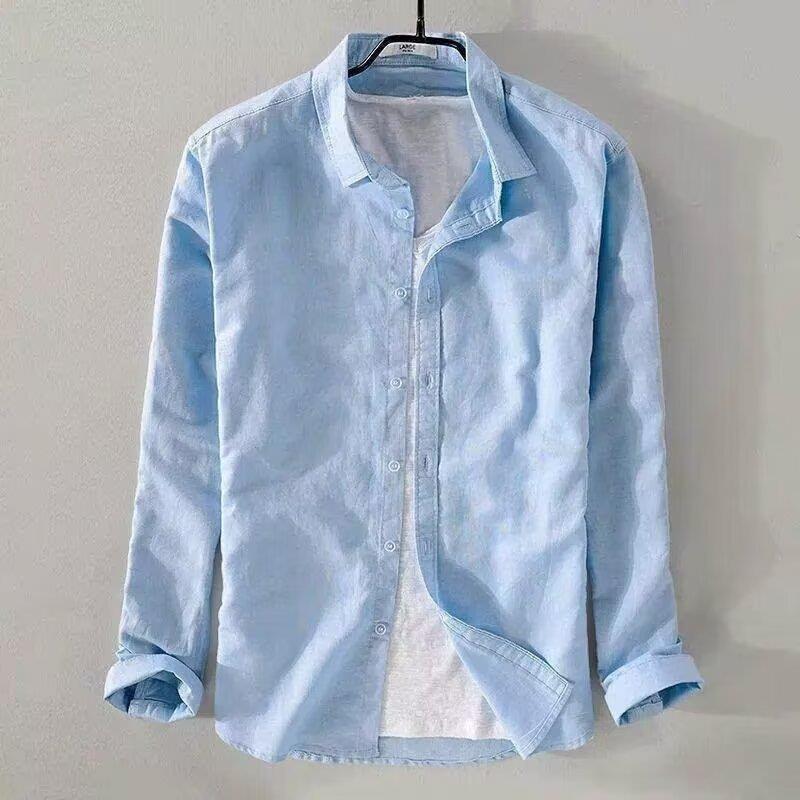 slim fit casual cardigan for teenagers in light blue hanging on a hanger with open collar and rolled sleeves.