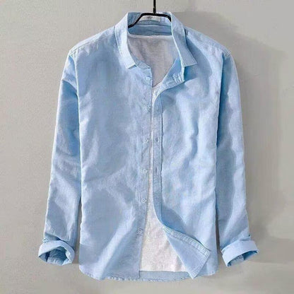 slim fit casual cardigan for teenagers in light blue hanging on a hanger with open collar and rolled sleeves.