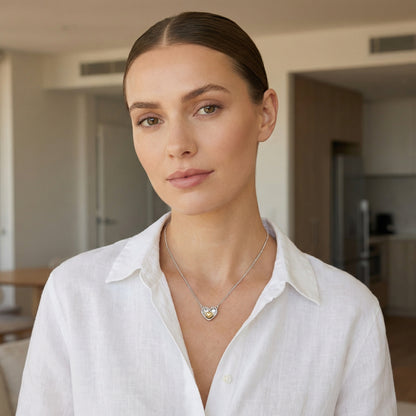 Model wearing a 925 Sterling Silver nested heart pendant necklace with two-tone accents.