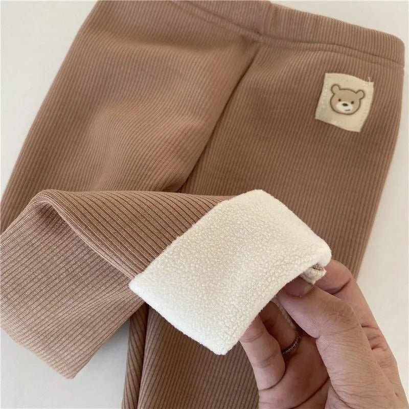 fleece-lined girls leggings in brown with plush lining and bear patch detail