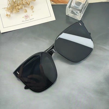 Mens And Womens Trendy Instagram-style Sunglasses with sleek black design and gray lenses, ideal for stylish looks.