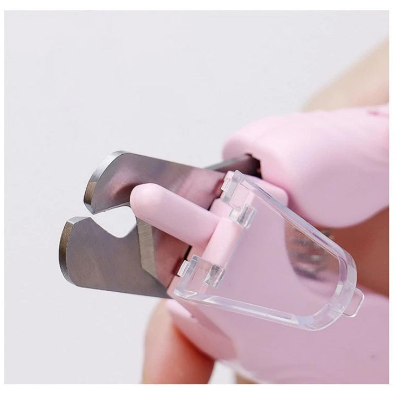 Close-up of white pet nail trimmer with light, showcasing precision cutting edge and ergonomic design for pets.