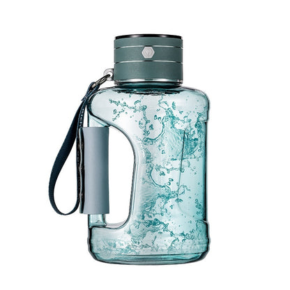 Portable kettle for mineral water bottles in peacock green color with a splash of water inside.