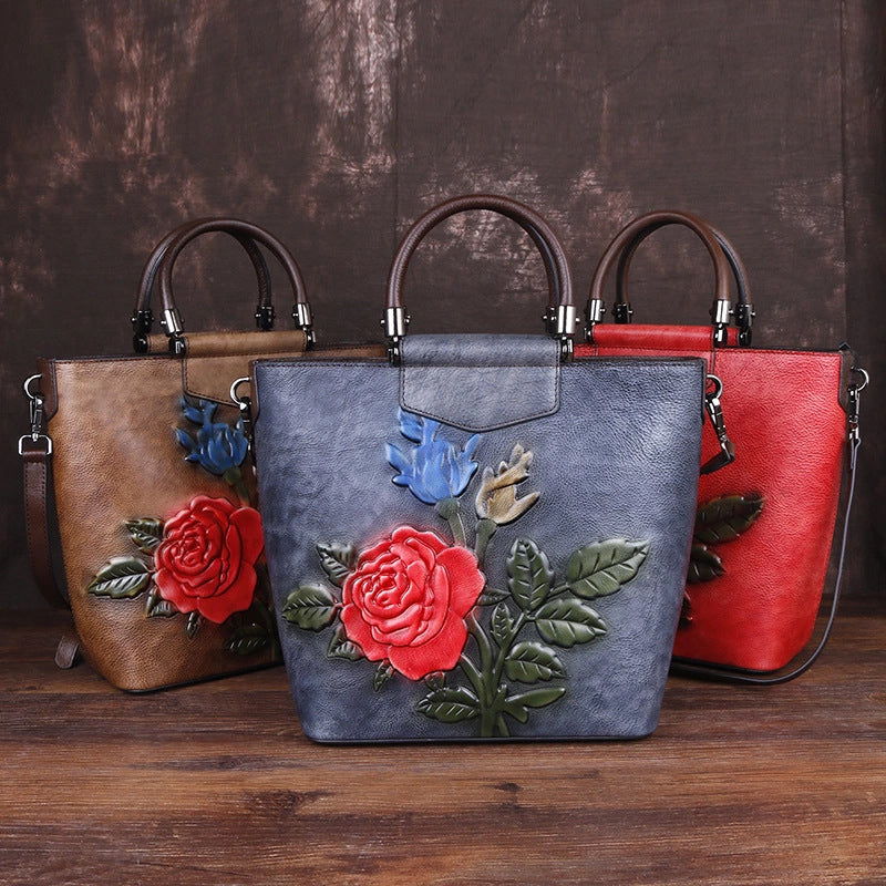Vintage leather tote bag collection featuring floral designs in brown, gray, and red.