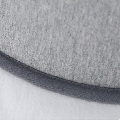 Close-up of the soft modal cotton fabric edge of a baby bed for acid reflux, highlighting comfort and breathability.