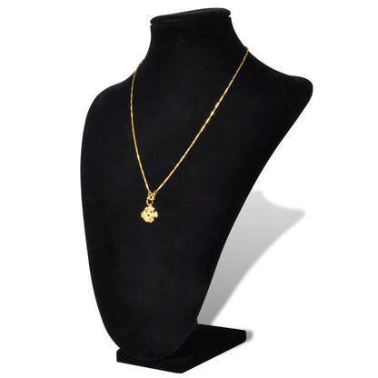 Flannel jewelry bust display showcasing a gold necklace with a charm on a black bust.