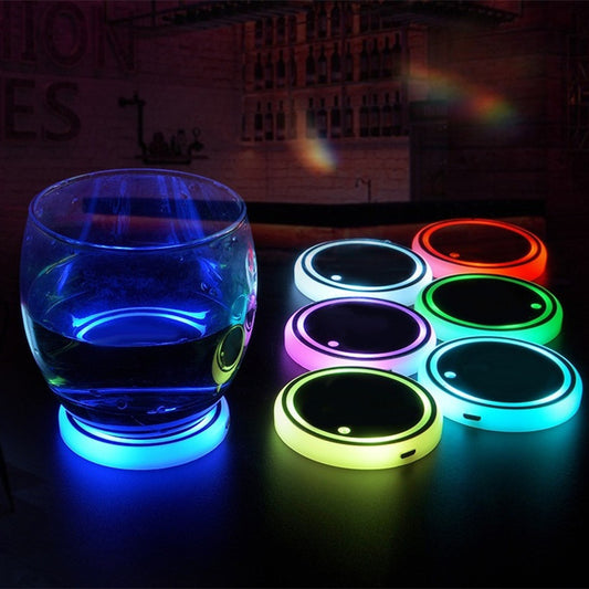 LED light-up car coaster with colorful ambient lighting and a glass of water on a table.