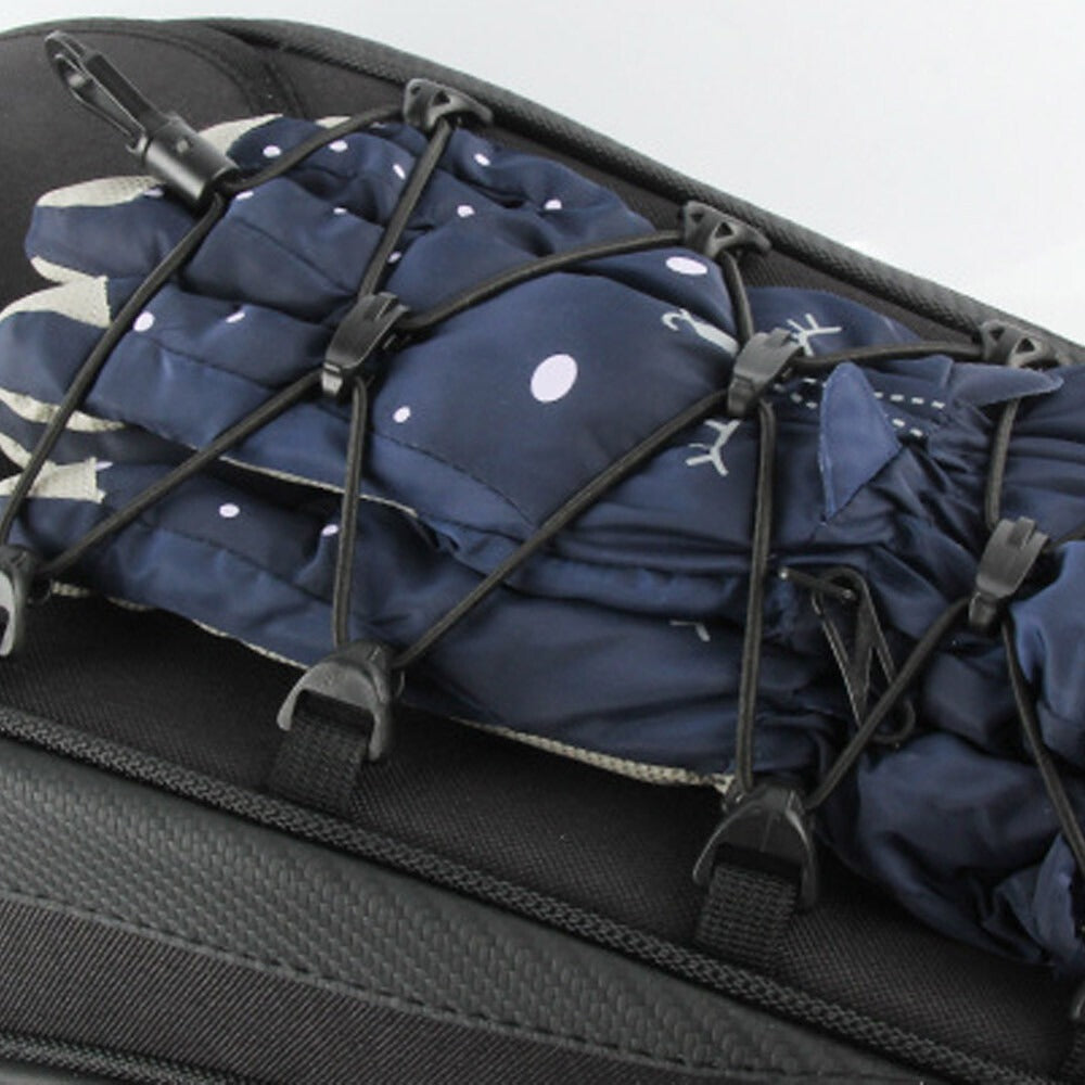 Motorcycle rear seat tail bag with gloves secured by elastic straps for safe storage while riding.