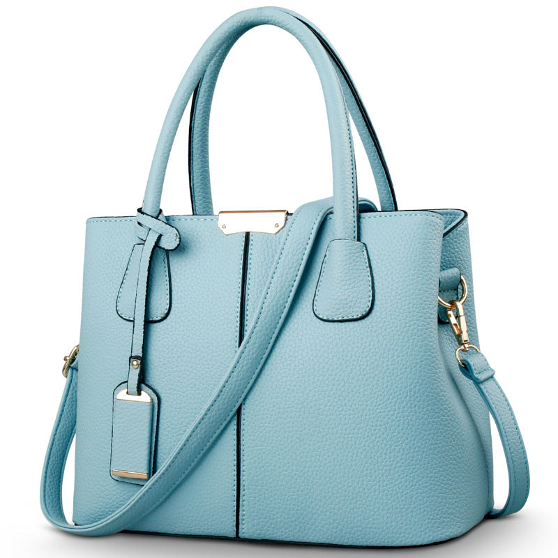 Women's large capacity tote bag in light blue, versatile for casual daily use with adjustable shoulder strap.