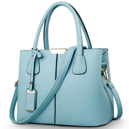 Women's large capacity tote bag in light blue, versatile for casual daily use with adjustable shoulder strap.