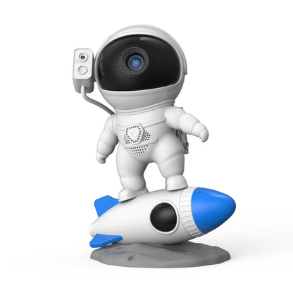 Rocket astronaut projector lamp figurine with a blue rocket, perfect for a starry sky theme.