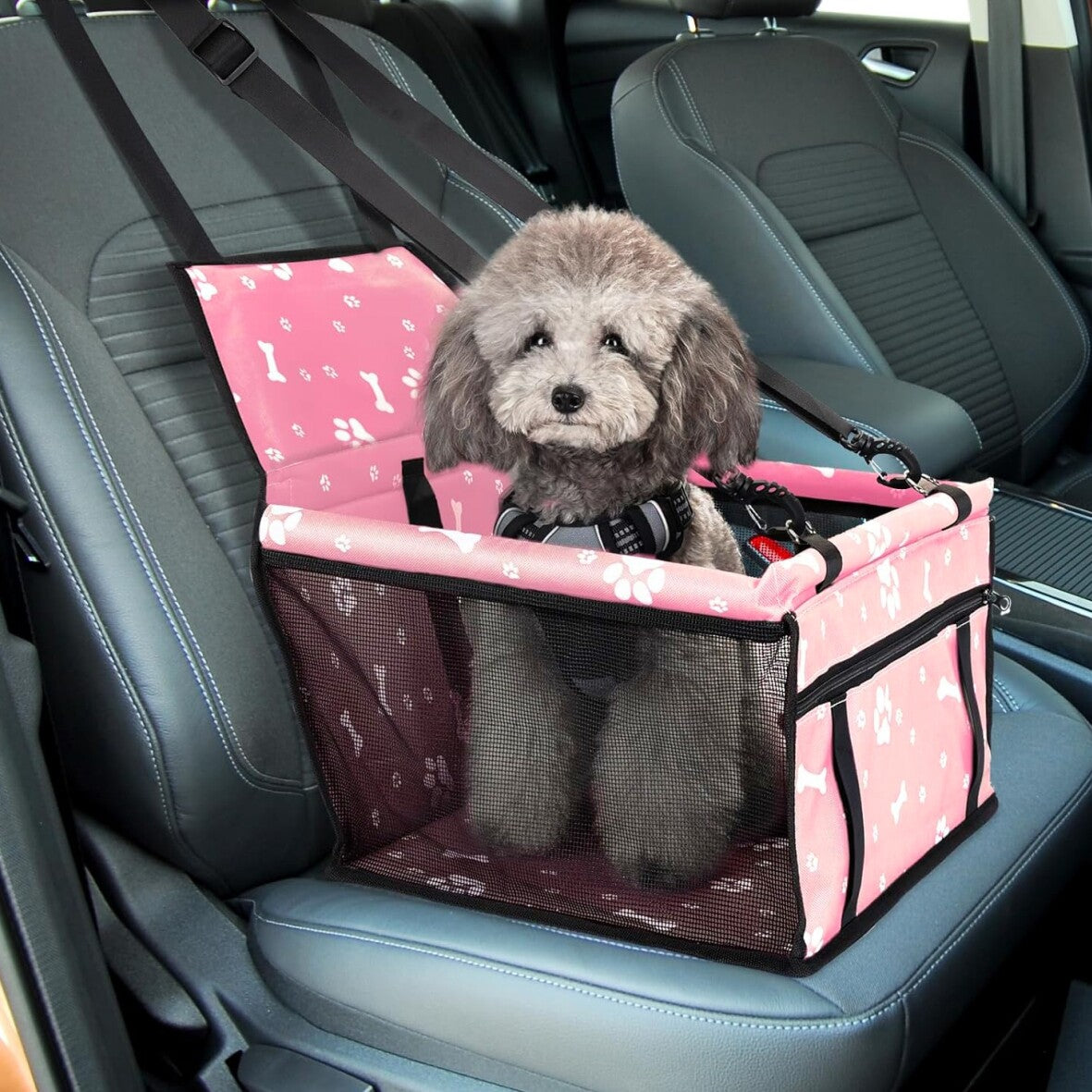 Portable dog car seat for small pets with safety strap and breathable mesh in car.