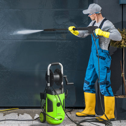 Man using portable high pressure washer 1800W to clean a wall with powerful water jet.